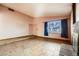 Bright living room with tile floors, neutral walls, fireplace and a large window at 4745 Desert Vista Rd, Las Vegas, NV 89121