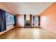 Inviting living room featuring tile flooring, a cozy brick fireplace, and large windows for ample light at 4745 Desert Vista Rd, Las Vegas, NV 89121