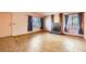 Spacious living room featuring tile flooring, a brick fireplace, and large windows offering natural light at 4745 Desert Vista Rd, Las Vegas, NV 89121