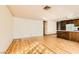 Open living area with wood flooring close to the kitchen at 4745 Desert Vista Rd, Las Vegas, NV 89121