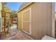 Home shed in backyard area with partial view of jacuzzi and lounging area at 4745 Desert Vista Rd, Las Vegas, NV 89121