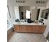 Bright bathroom featuring a double sink vanity and a large mirror at 4037 Gliding Gulls Ave, North Las Vegas, NV 89084