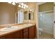 This bathroom has double sinks, plenty of counter space, a large mirror, and a shower/tub combo at 3301 Rodeo Ave, Pahrump, NV 89048