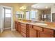 This bathroom has double sinks, ample counter space, a large mirror, and a separate toilet area at 3301 Rodeo Ave, Pahrump, NV 89048