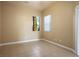 Neutral bedroom featuring tile flooring, a window with natural light and neutral walls at 3301 Rodeo Ave, Pahrump, NV 89048