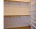 Walk-in closet equipped with shelving and hanging rods for optimal storage and organization at 3301 Rodeo Ave, Pahrump, NV 89048