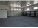 Large three car garage featuring plenty of space for vehicles and storage on a sealed concrete floor at 3301 Rodeo Ave, Pahrump, NV 89048