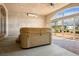 Relaxing sunroom featuring a hot tub, ceiling fan, and a large sliding glass door for outdoor views at 3301 Rodeo Ave, Pahrump, NV 89048