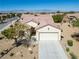 Single story house with a tile roof and desert landscaping at 3320 Kookaburra Way, North Las Vegas, NV 89084