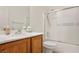 Clean bathroom with a shower/tub combo and wood vanity at 3320 Kookaburra Way, North Las Vegas, NV 89084