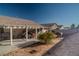 Covered patio, BBQ grill, and a small yard at 3337 Spinet Dr, North Las Vegas, NV 89032