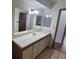 Bathroom with double sinks and a large mirror at 1321 Del Mar St # 4, Las Vegas, NV 89119