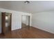 Bright bedroom with wood flooring and mirrored closet at 1321 Del Mar St # 4, Las Vegas, NV 89119