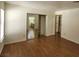 Bright bedroom with wood flooring and mirrored closet at 1321 Del Mar St # 4, Las Vegas, NV 89119