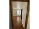 Spacious bedroom with wood flooring and mirrored closet doors at 1321 Del Mar St # 4, Las Vegas, NV 89119