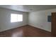 Simple bedroom with hardwood floors and a window at 1321 Del Mar St # 4, Las Vegas, NV 89119