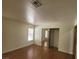 Spacious bedroom with wood floors and mirrored closet at 1321 Del Mar St # 4, Las Vegas, NV 89119