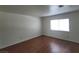 Simple bedroom with wood flooring and large window at 1321 Del Mar St # 4, Las Vegas, NV 89119