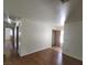 Long hallway with wood flooring and access to rooms at 1321 Del Mar St # 4, Las Vegas, NV 89119