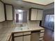 Kitchen features double sink and view to living room at 1321 Del Mar St # 4, Las Vegas, NV 89119