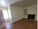 Living room with fireplace, built-in shelving and wood floors at 1321 Del Mar St # 4, Las Vegas, NV 89119