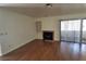 Living room with fireplace, built-in shelving and hardwood floors at 1321 Del Mar St # 4, Las Vegas, NV 89119