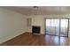 Living room with hardwood floors and access to patio at 1321 Del Mar St # 4, Las Vegas, NV 89119