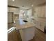 Modern kitchen with white cabinets and large island at 1441 Nocturnal Flight St, Las Vegas, NV 89138