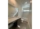 Clean bathroom with a bathtub, vanity, and wood-like floors at 1448 Nocturnal Flight St, Las Vegas, NV 89138