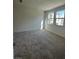 Bright bedroom featuring neutral carpeting and large windows at 1448 Nocturnal Flight St, Las Vegas, NV 89138