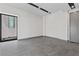 Spacious living area featuring grey tile floors and modern lighting at 14 Heron Harbour Dr, Henderson, NV 89011