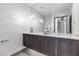 Modern powder room with dark vanity and floating sink at 14 Heron Harbour Dr, Henderson, NV 89011