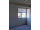Sunlit bedroom with blinds, neutral walls and carpet flooring at 5049 Spencer St # D, Las Vegas, NV 89119