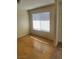 Bright bedroom with hardwood flooring and a window offering natural light at 5049 Spencer St # D, Las Vegas, NV 89119