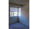 Carpeted bedroom features two windows letting in plenty of natural light at 5049 Spencer St # D, Las Vegas, NV 89119
