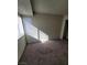 Bright bedroom with large window and neutral walls at 5049 Spencer St # D, Las Vegas, NV 89119