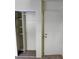 The closet in the bedroom has a shelving unit and a clothes rack at 5049 Spencer St # D, Las Vegas, NV 89119