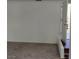 View of the carpeted living room and open doorway to the home's exterior at 5049 Spencer St # D, Las Vegas, NV 89119