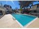 Community swimming pool surrounded by well-maintained landscaping, offering a leisure and recreation amenity at 5049 Spencer St # D, Las Vegas, NV 89119