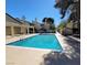 Community swimming pool with nearby lounge chairs, showing an inviting space for relaxation and socializing at 5049 Spencer St # D, Las Vegas, NV 89119