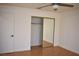 Bedroom with mirrored closet doors and hardwood floor at 1708 Walrus St, Las Vegas, NV 89117