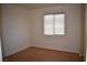 Simple bedroom with hardwood floors and window at 1708 Walrus St, Las Vegas, NV 89117