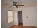 Bright bedroom with wood floors, ceiling fan, and spacious closet at 1708 Walrus St, Las Vegas, NV 89117