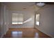 Bright living room with hardwood floors and two windows at 1708 Walrus St, Las Vegas, NV 89117