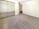 Spacious bedroom with mirrored closet doors at 900 Boulder Springs Dr # 202, Las Vegas, NV 89128