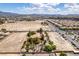 Aerial view of house and expansive lot, near a main road and other homes at 1860 E Ford Ave, Las Vegas, NV 89123