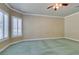 Large bedroom with plush carpet, ceiling fan and window shutters at 1860 E Ford Ave, Las Vegas, NV 89123