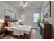 Bedroom with a wood bed frame and neutral colors at 1860 E Ford Ave, Las Vegas, NV 89123