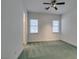 Well-lit bedroom with two windows and ceiling fan at 1860 E Ford Ave, Las Vegas, NV 89123