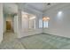 Elegant dining room with a chandelier and views of the entryway and hallway at 1860 E Ford Ave, Las Vegas, NV 89123